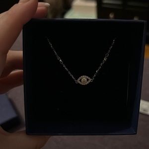 Swarovski eye necklace.